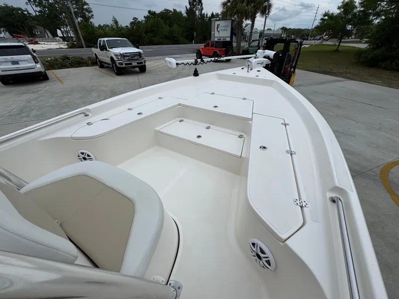 Slide: The Image of 2024 Bulls Bay 2400 boat interior with seating and storage compartments. - 19