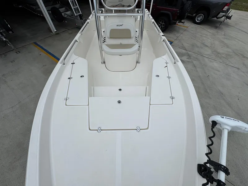 Slide: The Image of 2024 Bulls Bay 2400 boat interior with seating and storage compartments. - 21