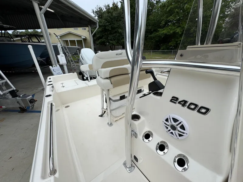 Slide: The Image of 2024 Bulls Bay 2400 boat interior with seating and control panel. - 26