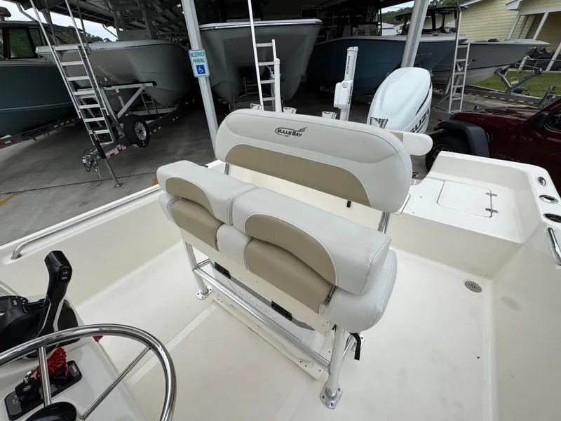 Slide: The Image of 2024 Bulls Bay 2400 boat interior with dual seating and steering wheel. - 27