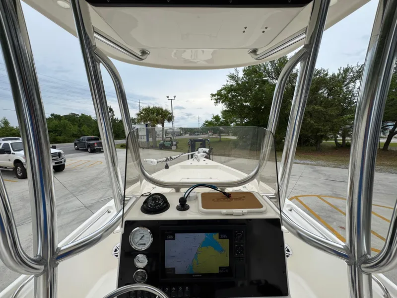Slide: The Image of 2024 Bulls Bay 2400 boat dashboard with navigation system and controls. - 31