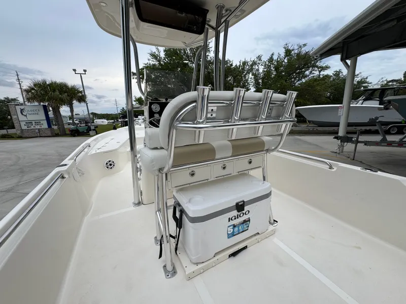 Slide: The Image of 2024 Bulls Bay 2400 boat interior with seating and Igloo cooler. - 33