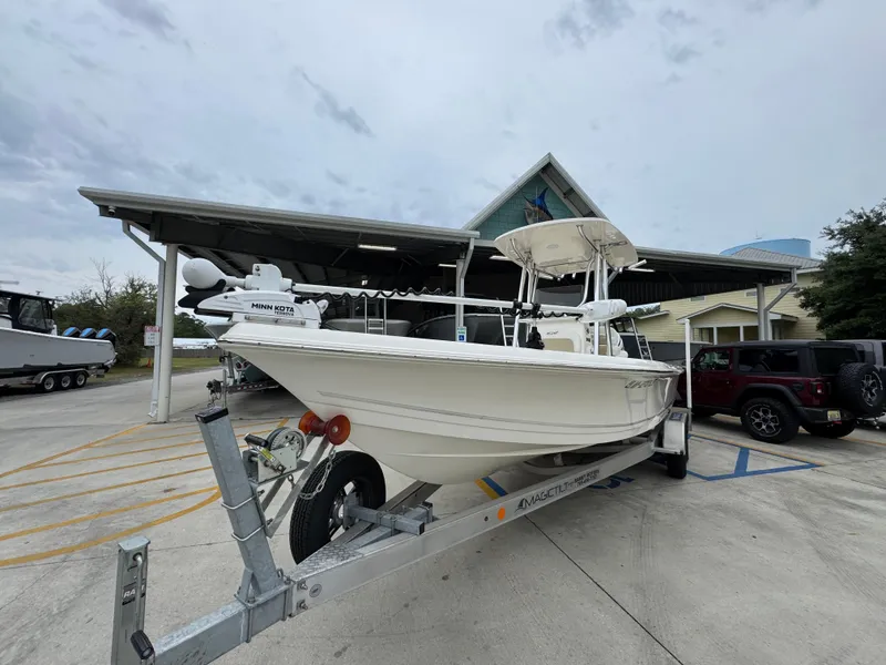 Slide: The Image of 2024 Bulls Bay 2400 boat on trailer, parked outside a building. - 5