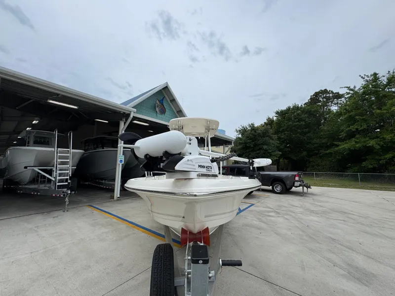 Slide: The Image of 2024 Bulls Bay 2400 boat on trailer outside a storage facility. - 7