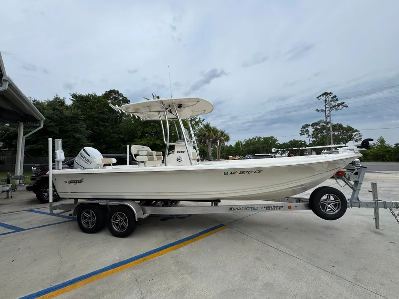 Slide: The Image of 2024 Bulls Bay 2400 boat on trailer, parked outdoors, side view. - 9