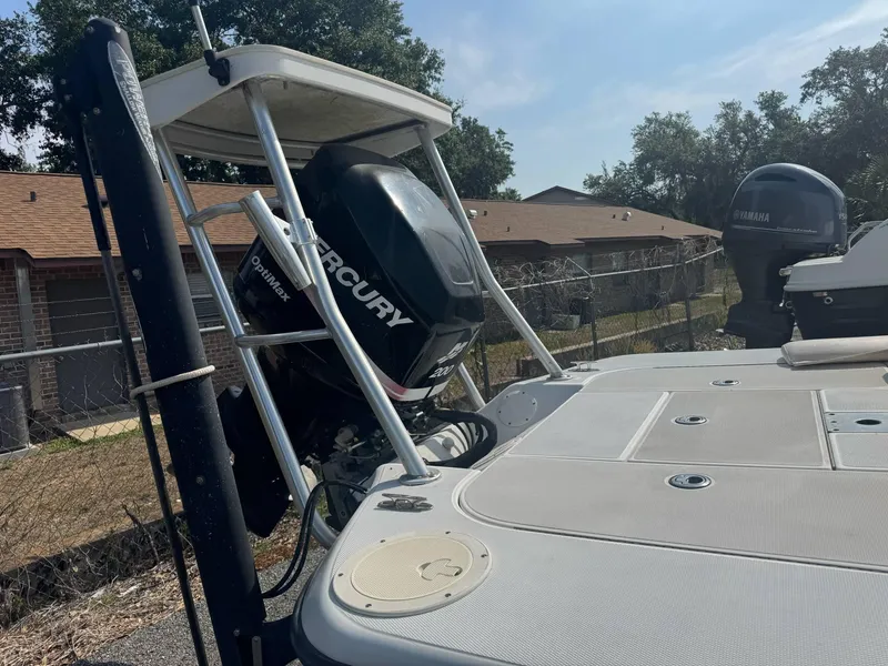 Slide: The Image of 2002 Ranger 191 Cayman boat with Mercury outboard motor, parked outdoors. - 6