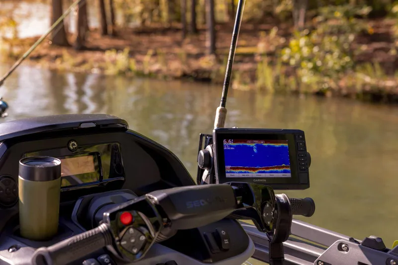 Slide: The Image of 2025 Sea-Doo Switch Fish 21 dashboard with navigation and fishing equipment. - 13