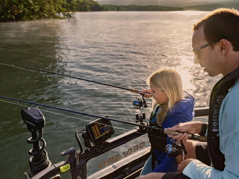 Slide: The Image of Father and daughter fishing on a 2025 Sea-Doo Switch™ Fish 21 boat. - 15