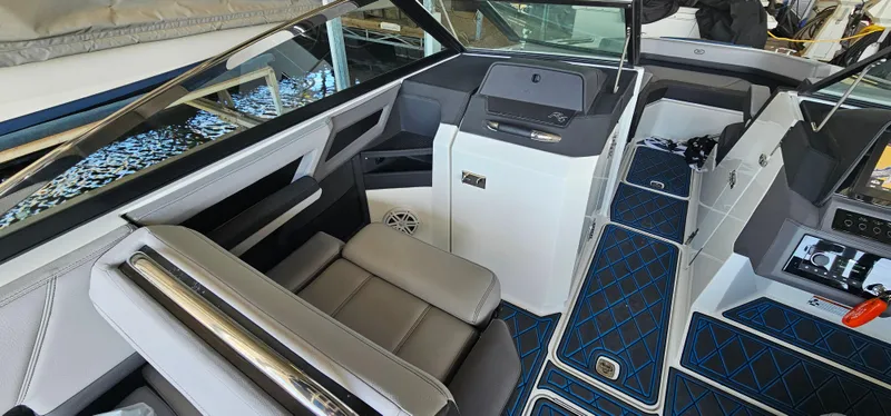 Slide: The Image of Interior of a 2022 Cobalt R6 boat with modern seating and dashboard. - 14