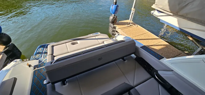 Slide: The Image of 2022 Cobalt R6 boat interior with seating, docked by the water. - 20