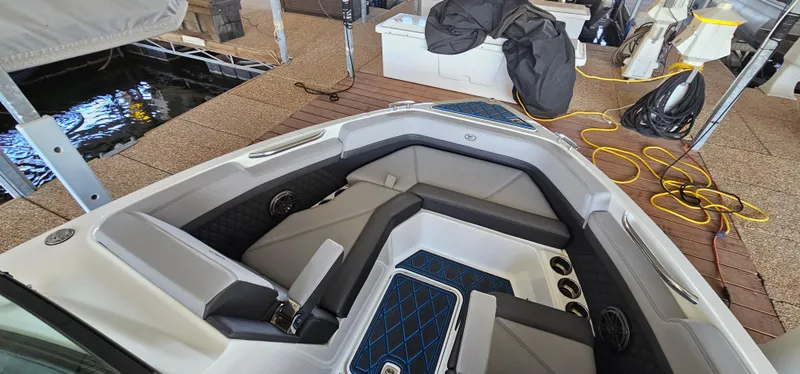 Slide: The Image of 2022 Cobalt R6 boat interior with cushioned seating and modern design. - 24