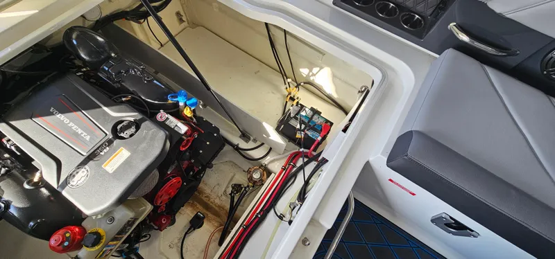 Slide: The Image of Engine compartment of a 2022 Cobalt R6 boat, showcasing detailed mechanical components. - 28