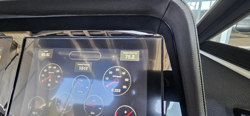 Slide: The Image of Dashboard of a 2022 Cobalt R6 boat displaying various gauges and engine metrics. - 29