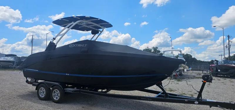 Slide: The Image of 2022 Cobalt R6 boat on trailer under blue sky with clouds. - 4