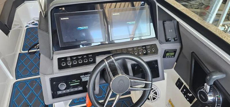 Slide: The Image of 2022 Cobalt R6 boat dashboard with dual Garmin displays and modern controls. - 6