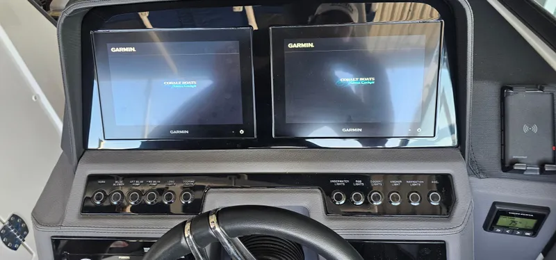 Slide: The Image of 2022 Cobalt R6 dashboard with dual Garmin screens and control panel. - 7