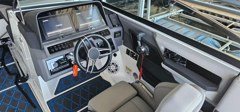 Slide: The Image of 2022 Cobalt R6 boat cockpit with modern controls and dual display screens. - 8