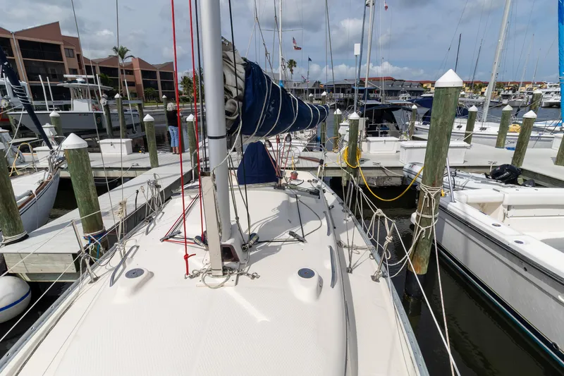 Slide: The Image of Sailboat docked at marina, 2011 Hake Seaward 32 RK, with masts and rigging visible. - 13
