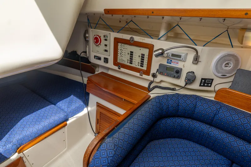 Slide: The Image of Interior of 2011 Hake Seaward 32 RK sailboat with navigation equipment and blue seating. - 32