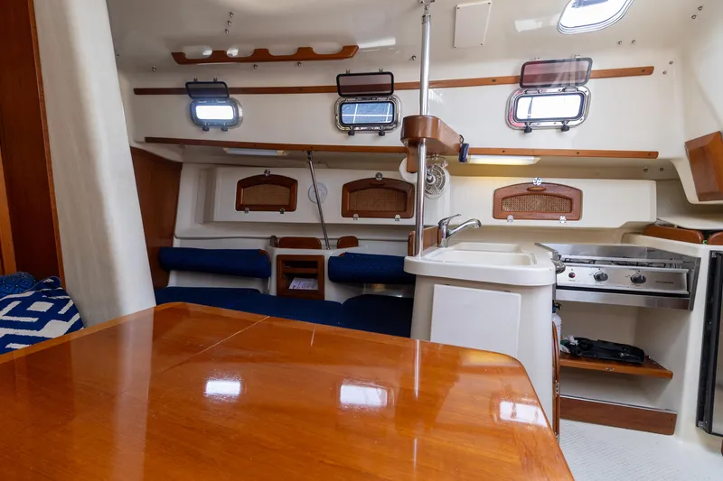 Slide: The Image of Interior of 2011 Hake Seaward 32 RK sailboat with wood finishes and compact kitchen. - 35