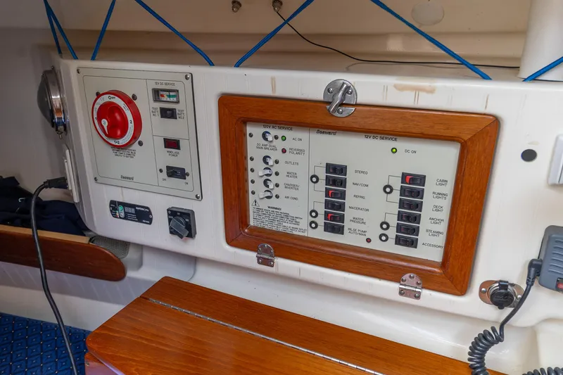 Slide: The Image of Control panel of a 2011 Hake Seaward 32 RK sailboat, featuring switches and gauges. - 37