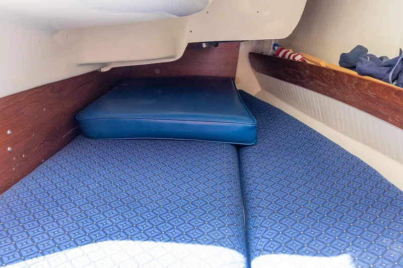 Slide: The Image of Interior cabin of 2011 Hake Seaward 32 RK sailboat with blue cushions. - 39