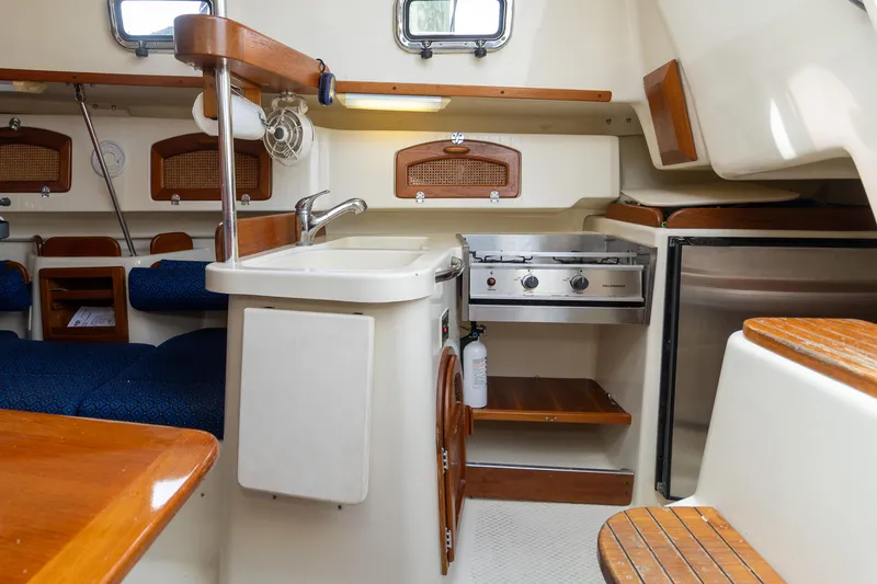 Slide: The Image of Interior of 2011 Hake Seaward 32 RK sailboat with compact kitchen and seating area. - 41