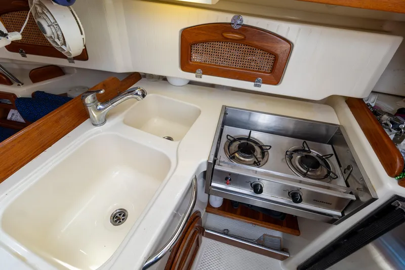 Slide: The Image of 2011 Hake Seaward 32 RK yacht kitchen with dual sink and two-burner stove. - 43
