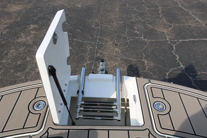 Slide: The Image of 2016 Bayliner 215 Deck Boat swim platform with foldable ladder. - 30