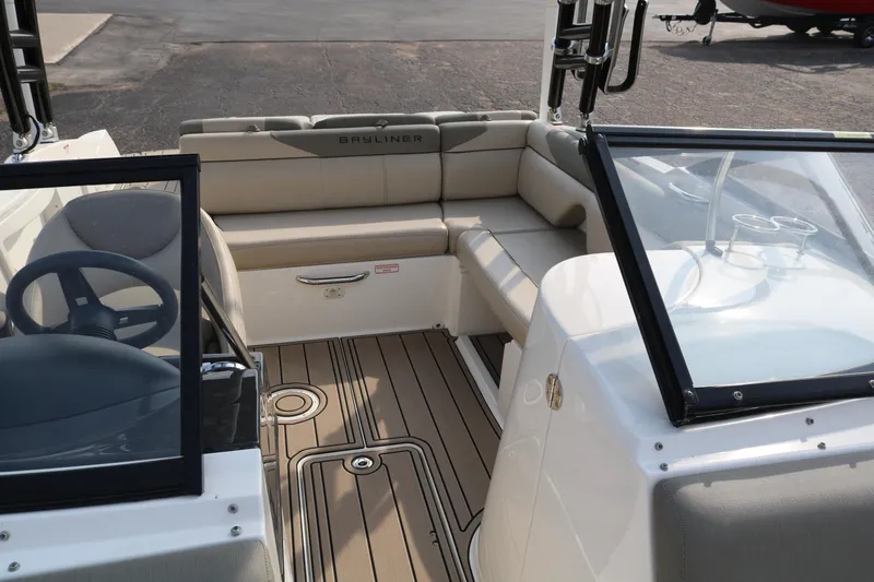 Slide: The Image of 2016 Bayliner 215 Deck Boat interior with seating and steering wheel. - 31