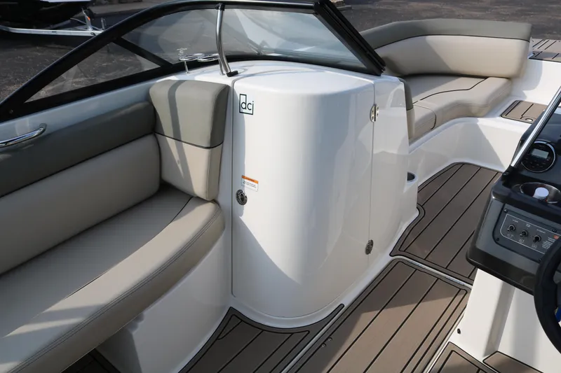 Slide: The Image of 2016 Bayliner 215 Deck Boat interior with beige seating and sleek design. - 32