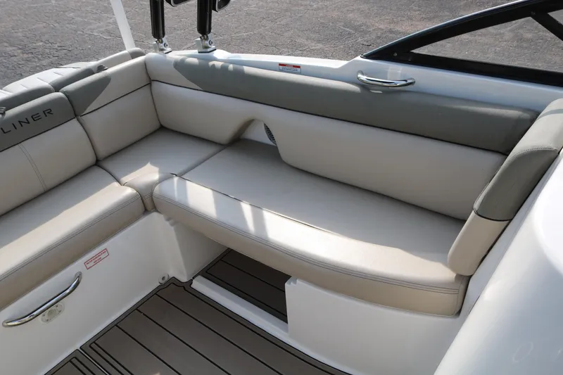 Slide: The Image of 2016 Bayliner 215 Deck Boat interior with beige seating and sleek design. - 34