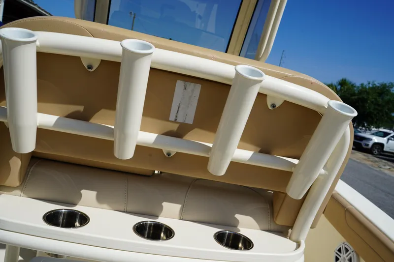 Slide: The Image of 2022 Scout 215 XSF boat with rod holders and cup holders on the backrest. - 16