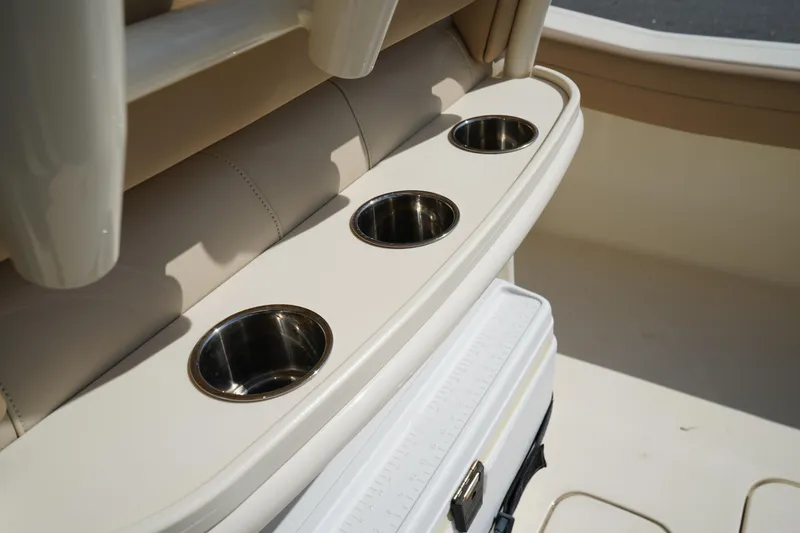 Slide: The Image of 2022 Scout 215 XSF boat interior with three stainless steel cup holders. - 17
