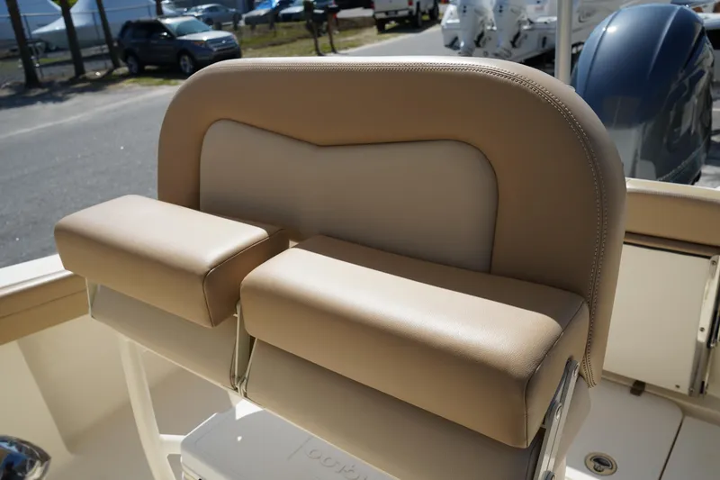 Slide: The Image of 2022 Scout 215 XSF boat seat with beige upholstery and armrests. - 21