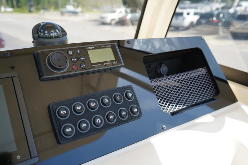 Slide: The Image of Control panel of 2022 Scout 215 XSF boat with navigation and radio equipment. - 25