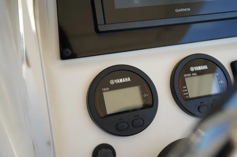 Slide: The Image of Close-up of Yamaha gauges on 2022 Scout 215 XSF boat dashboard. - 26