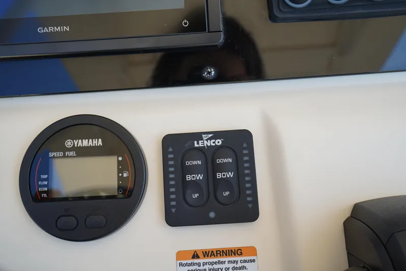 Slide: The Image of Control panel of 2022 Scout 215 XSF boat with Yamaha and Lenco systems. - 27
