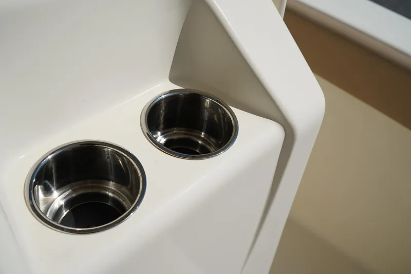 Slide: The Image of Cup holders on 2022 Scout 215 XSF boat, featuring sleek stainless steel design. - 29