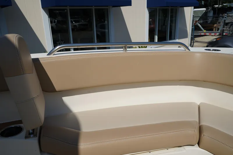 Slide: The Image of 2022 Scout 215 XSF boat interior with beige seating and stainless steel railing. - 36