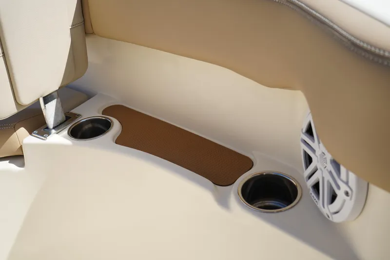 Slide: The Image of 2022 Scout 215 XSF boat interior with cup holders and speaker. - 37
