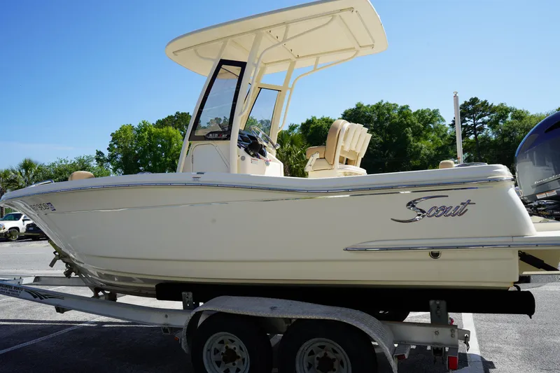 Slide: The Image of 2022 Scout 215 XSF boat on trailer, side view, sunny day. - 4