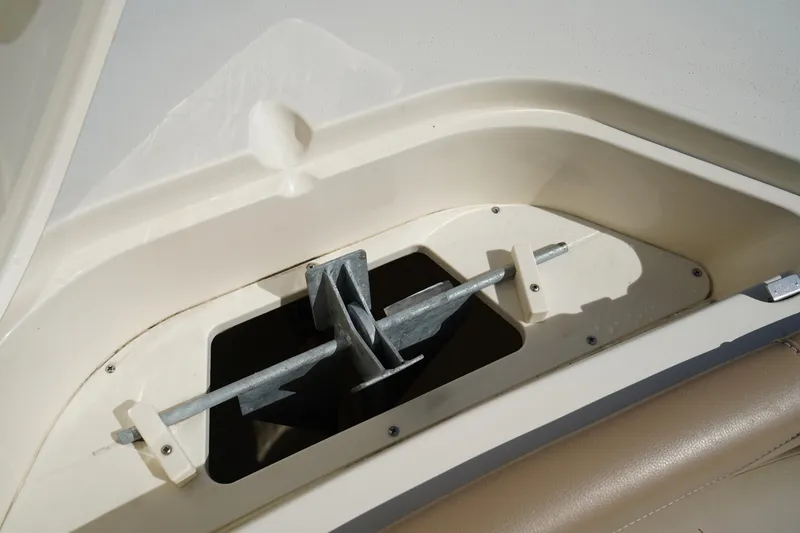 Slide: The Image of Anchor compartment of 2022 Scout 215 XSF boat, showcasing storage design. - 41
