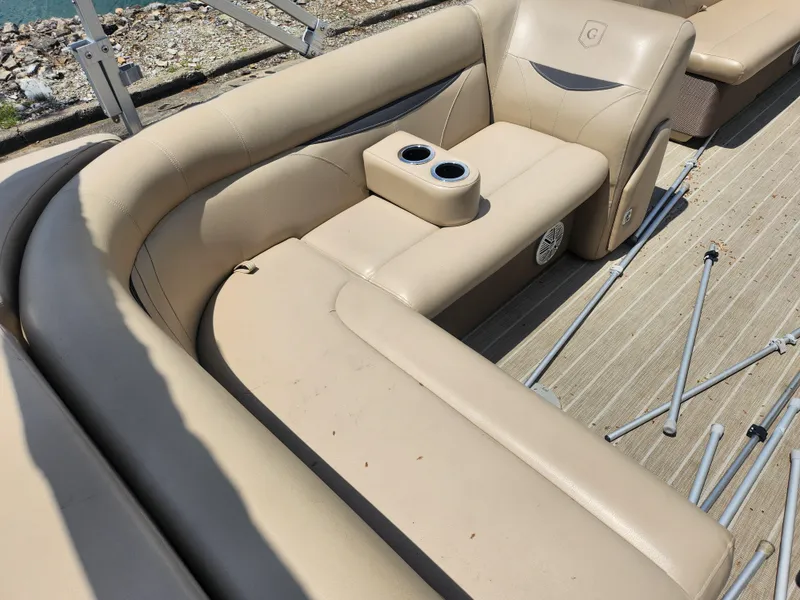 Slide: The Image of Luxurious beige seating on 2018 Sweetwater 2086 C pontoon boat with cup holders. - 17