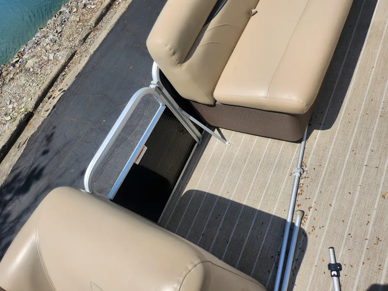 Slide: The Image of Beige seating on 2018 Sweetwater 2086 C pontoon boat, near water's edge. - 23