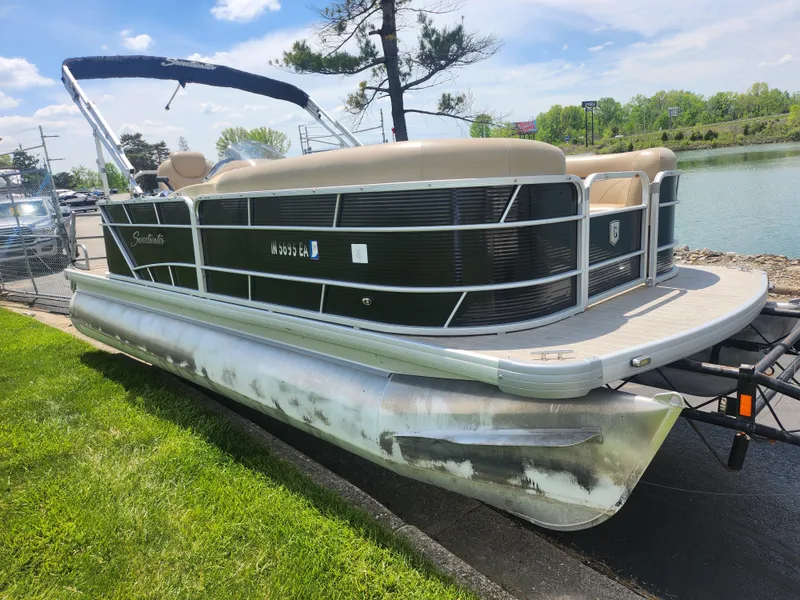 Slide: The Image of 2018 Sweetwater 2086 C pontoon boat parked near a lake on a sunny day. - 7