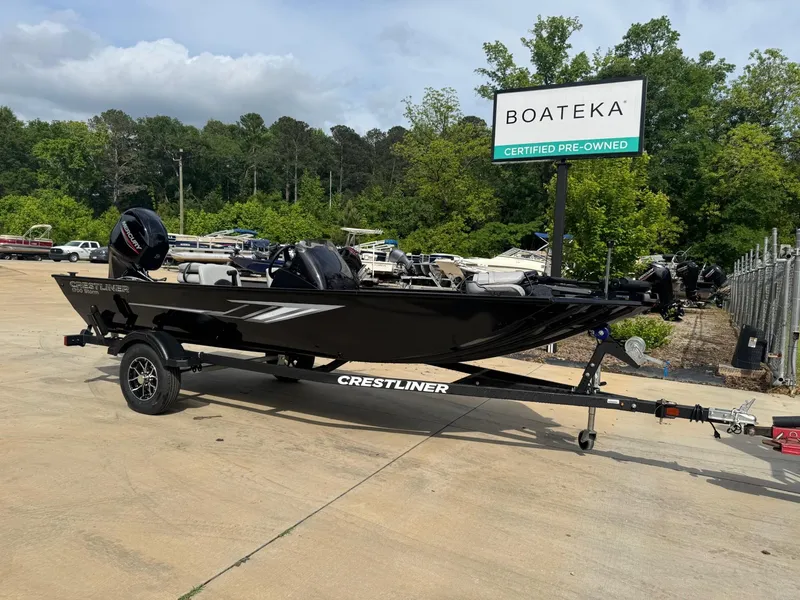 Slide: The Image of 2025 Crestliner 1700 Storm boat on trailer at Boateka dealership. - 1