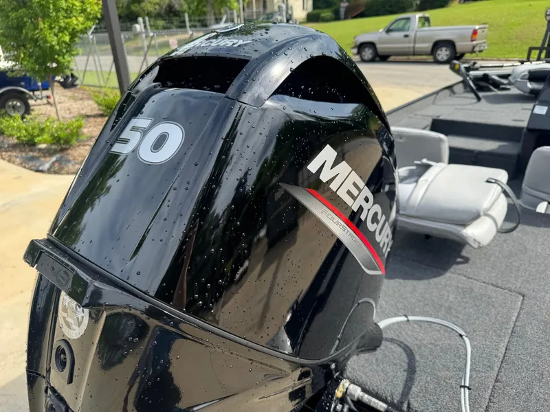 Slide: The Image of 2025 Crestliner 1700 Storm boat with Mercury 50 engine, parked outdoors. - 4