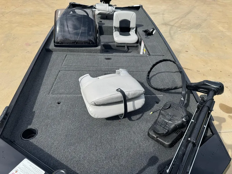 Slide: The Image of 2025 Crestliner 1700 Storm boat interior with seating and control panel. - 5