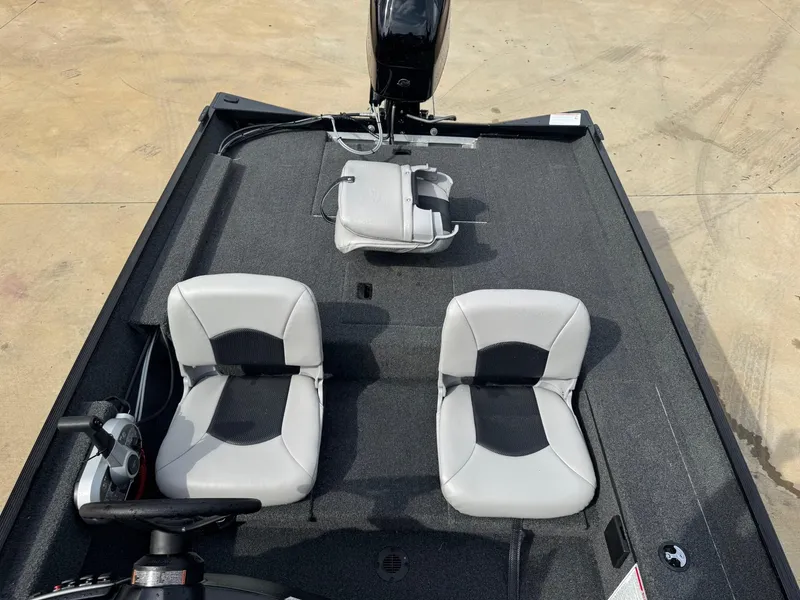 Slide: The Image of 2025 Crestliner 1700 Storm boat interior with dual seats and steering console. - 6